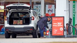 Residents fill gas containers just outside the effected area during a power outage round Southern Pines on December 6, 2022.