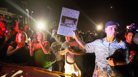 In this file photo, protesters confront a vehicle carrying Casey Anthony after she was acquitted in the death of her daughter, Caylee, in July 2011. 