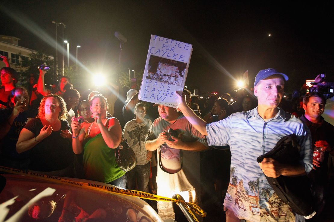 In this file photo, protesters confront a vehicle carrying Casey Anthony after she was acquitted in the death of her daughter, Caylee, in July 2011. 