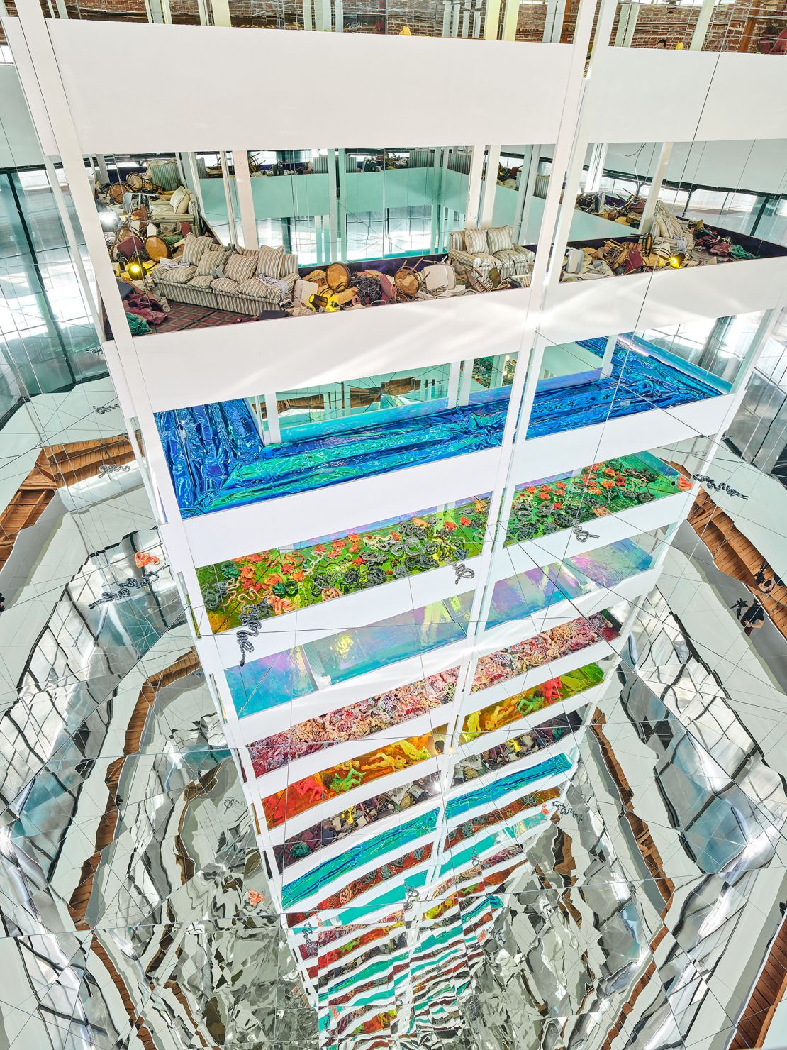 "Guts" is a vertiginous multi-layered architectural installation that uses mirror reflections to appear infinite.