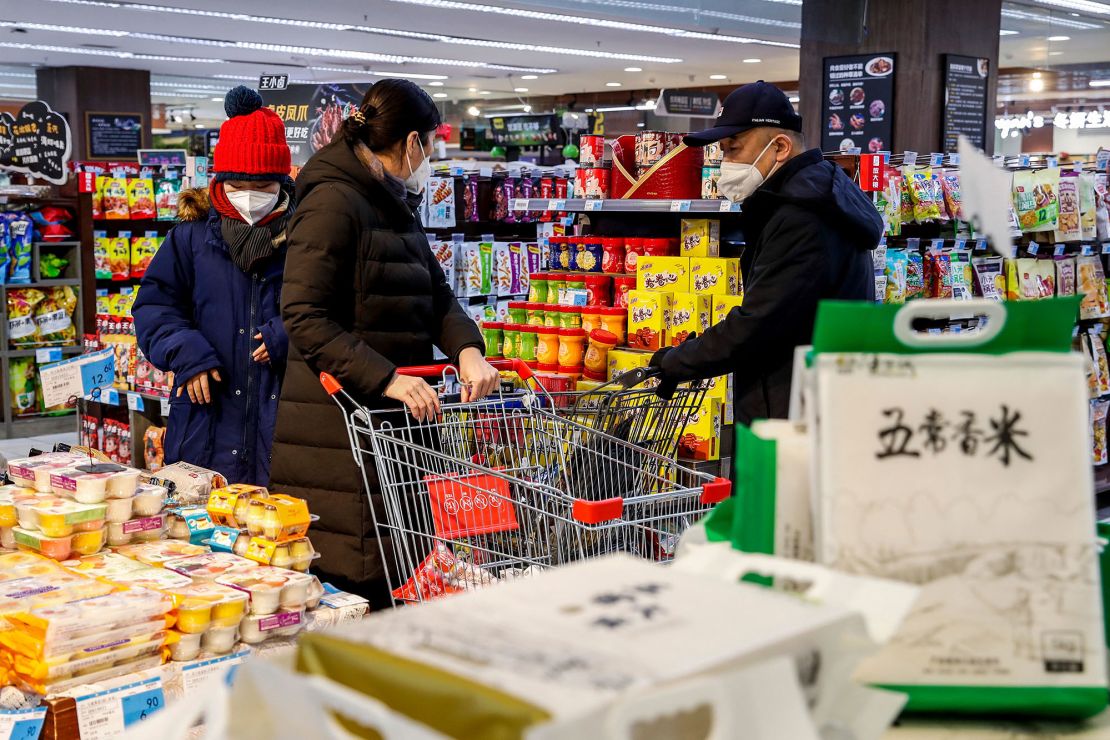 People shopping at a supermarket in Urumqi, China, on December 5.