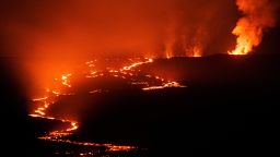 Lava fountains and flows illuminate the area with a glow at the Mauna Loa volcano eruption in Hawaii, U.S. December 5, 2022. 