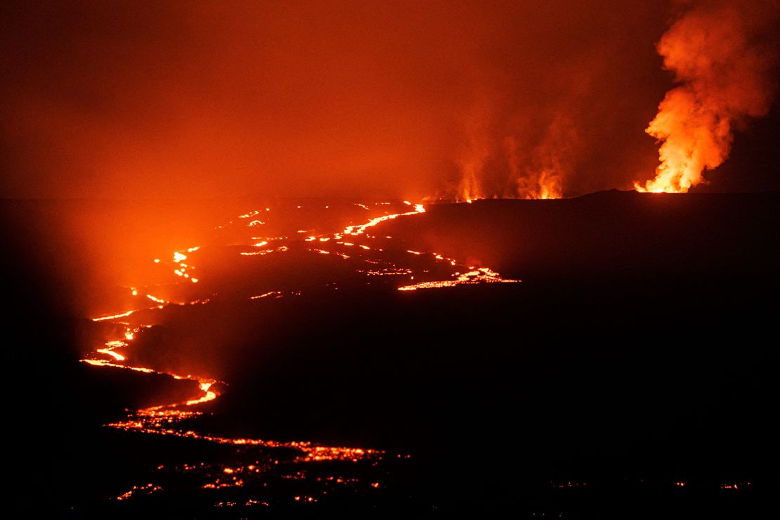 Lava fountains and flows illuminate the sky Monday near Mauna Loa.