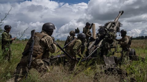 FILE - Ukrainian servicemen prepare to fire at Russian positions from a U.S.-supplied M777 howitzer in Kharkiv region, Ukraine, July 14, 2022. Supplies of Western weapons, including U.S. HIMARS multiple rocket launchers, has significantly boosted the Ukrainian military's capability, allowing it to target Russian munitions deports, bridges and other key facilities with precision and impunity.