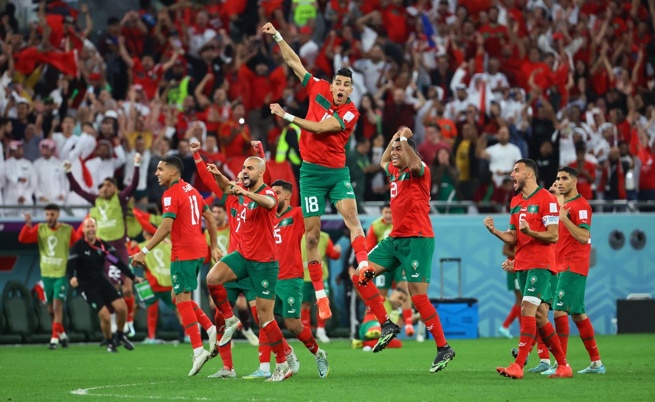 Morocco players celebrate after Achraf Hakimi scored to win a penalty shootout against Spain on Tuesday. The match ended 0-0 before going to the shootout.