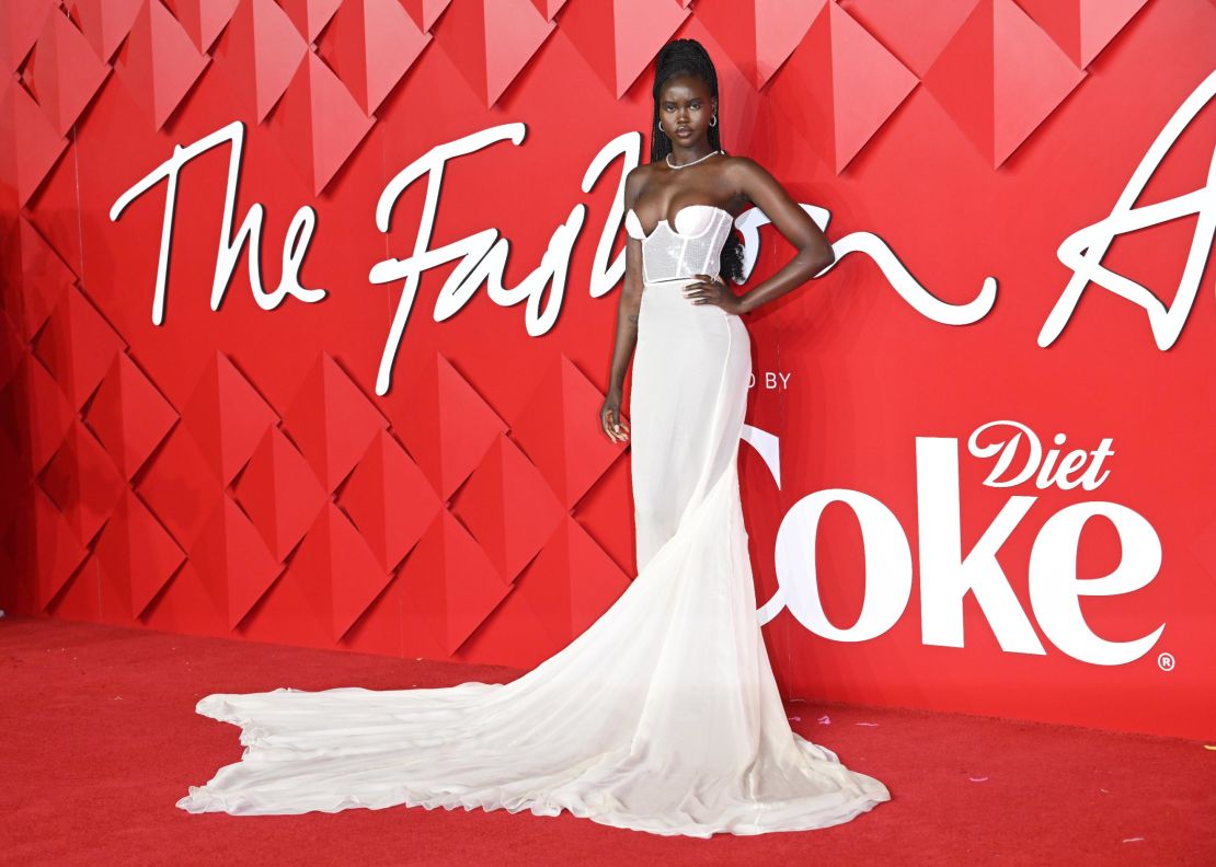 Adut Akech, Model of the Year 2019 and nominee for 2022, arrived at the Fashion Awards 2022 in a Nensi Dojaka gown with white sequins.