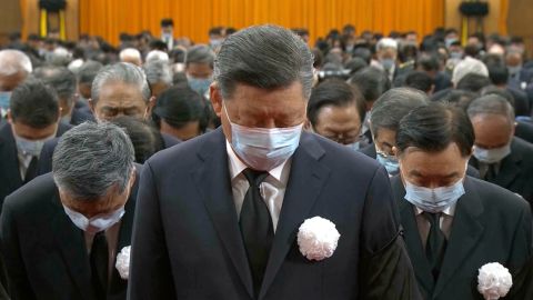 Chinese leader Xi Jinping leads other officials to bow during a formal memorial for late former Chinese leader Jiang Zemin in Beijing on December 6, 2022. 