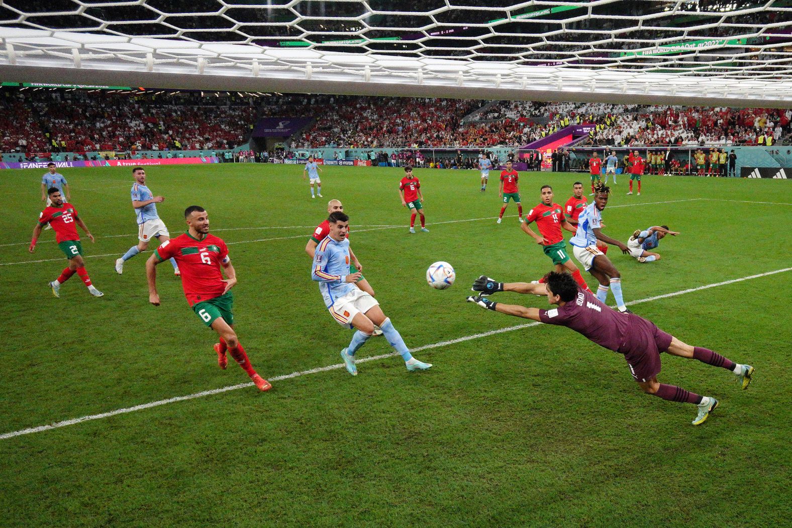 Morocco goalkeeper Yassine Bounou makes a save near the end of the Spain match. 