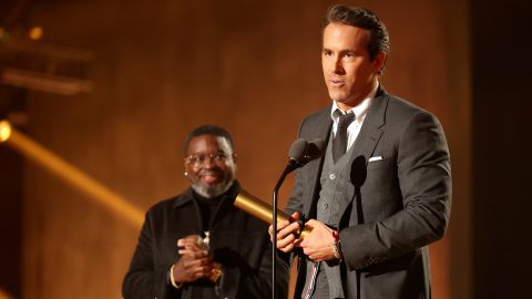 Lil Rel Howery presents The People's Icon award to honoree Ryan Reynolds on stage during the 2022 People's Choice Awards held at the Barker Hangar on December 6, 2022 in Santa Monica, California.