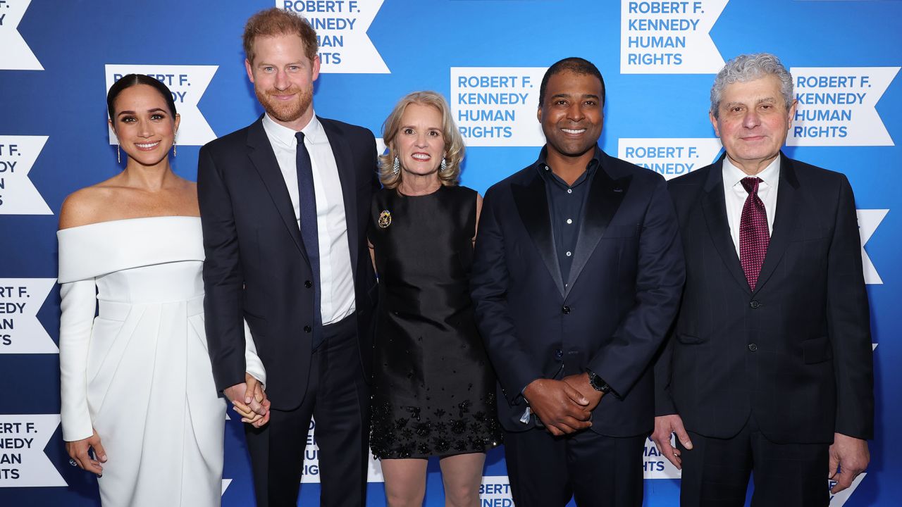 (L-R) Meghan, Duchess of Sussex and Prince Harry pose alongside RFKHR President Kerry Kennedy and fellow 2022 Ripple of Hope Award laureates Frank Baker and Michael Polsky. 