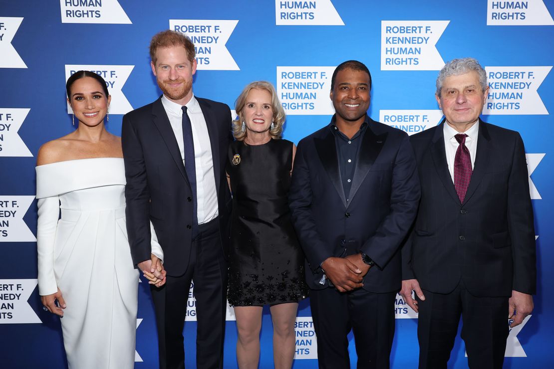 (L-R) Meghan, Duchess of Sussex and Prince Harry pose alongside RFKHR President Kerry Kennedy and fellow 2022 Ripple of Hope Award laureates Frank Baker and Michael Polsky. 
