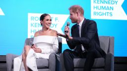 NEW YORK, NEW YORK - DECEMBER 06: Meghan, Duchess of Sussex and Prince Harry, Duke of Sussex speak onstage at the 2022 Robert F. Kennedy Human Rights Ripple of Hope Gala at New York Hilton on December 06, 2022 in New York City. (Photo by Kevin Mazur/Getty Images for 2022 Robert F. Kennedy Human Rights Ripple of Hope Gala)