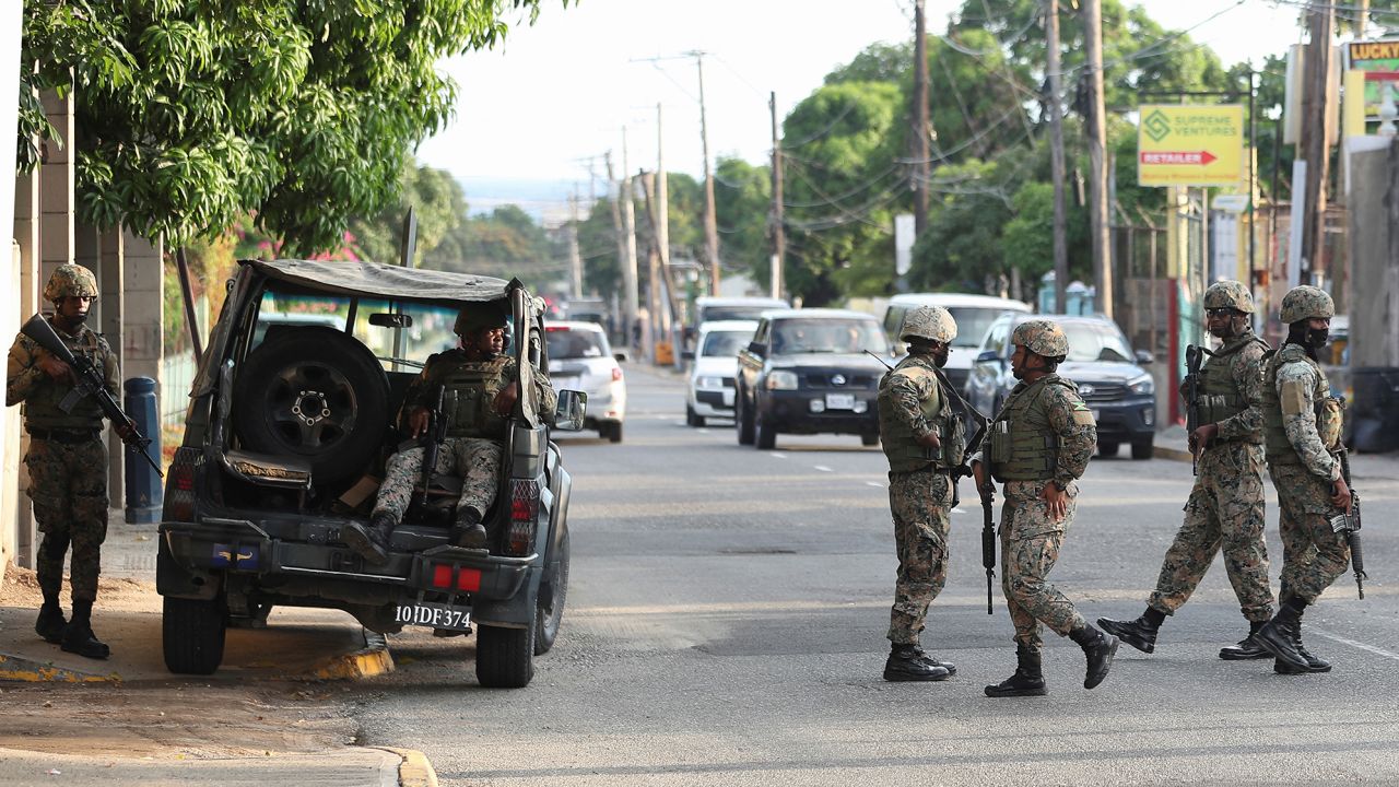 Members of security forces guard the streets after Jamaican Prime Minister Andrew Holness declared a state of public emergency in parts of the capital Kingston, on November 15, 2022. 