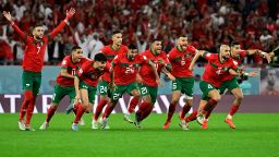 TOPSHOT - Morocco's celebrate winning during the penalty shoot-out to win the Qatar 2022 World Cup round of 16 football match between Morocco and Spain at the Education City Stadium in Al-Rayyan, west of Doha on December 6, 2022. (Photo by JAVIER SORIANO / AFP) (Photo by JAVIER SORIANO/AFP via Getty Images)