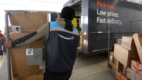 An Amazon driver loads packages into a delivery van at an Amazon delivery station on November 28, 2022 in Alpharetta, Georgia. Amazon is offering deep discounts on popular products ffor Cyber Monday, its busiest shopping day of the year.
