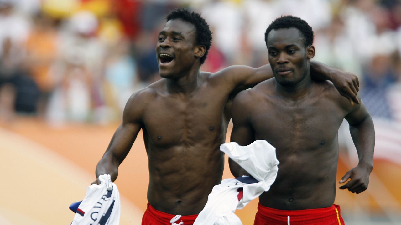 Boateng celebrates Ghana's victory over the United States at the 2006 World Cup alongside star midfielder Michael Essien.