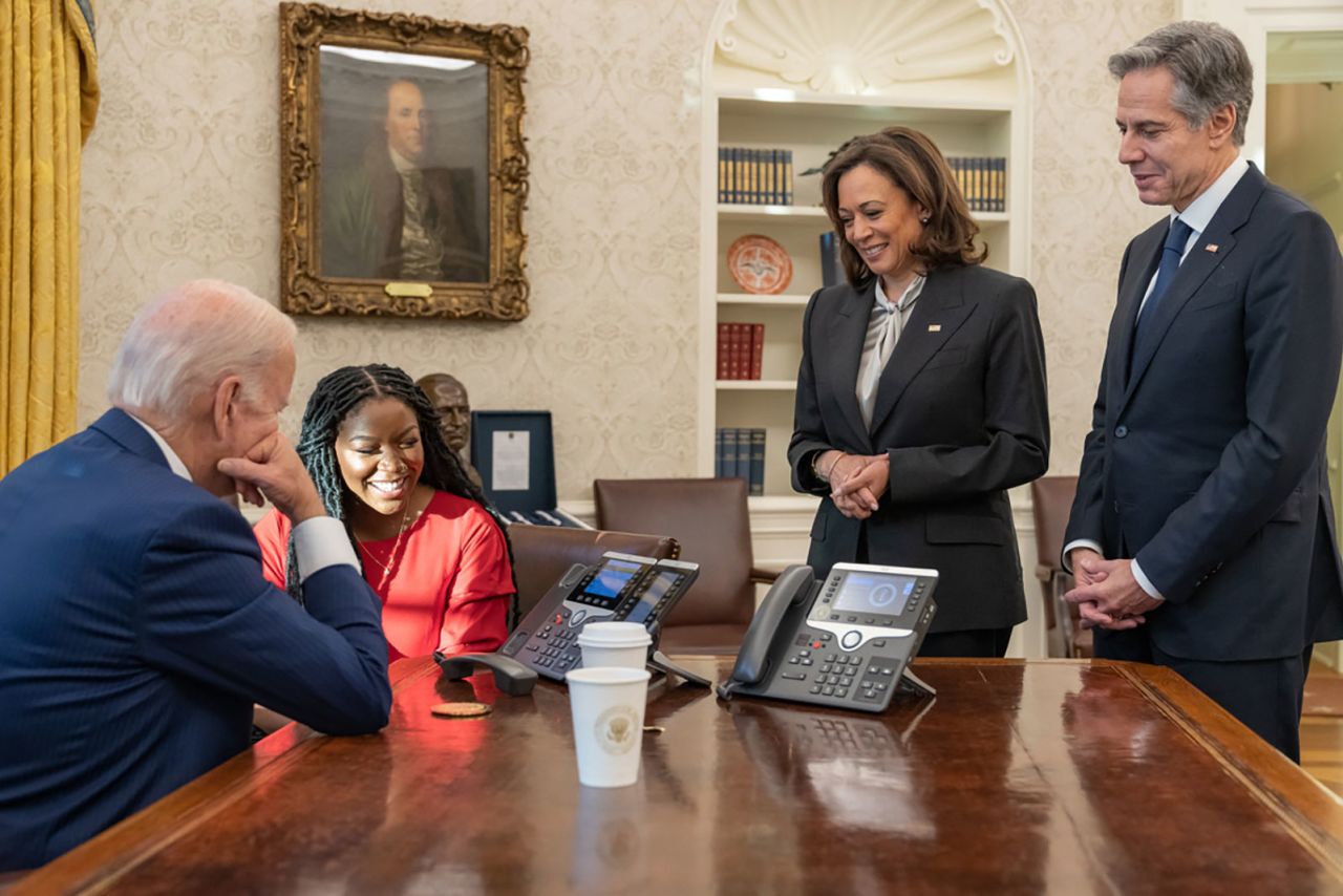 Griner's wife, Cherelle, sits with President Joe Biden as they talk with Griner on the phone after her release. This photo was tweeted on the president's account, saying about Griner: "She is safe. She is on a plane. She is on her way home." On the right are Vice President Kamala Harris and Secretary of State Antony Blinken.