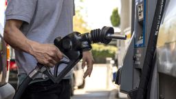 A driver returns a fuel nozzle to a gas pump at a Chevron gas station in San Francisco, California, U.S., on Monday, March 7, 2022. The average price of gasoline in the U.S. jumped above $4 a gallon for the first time since 2008 in a clear sign of the energy inflation that's hurt consumers since Russia invaded Ukraine. Photographer: David Paul Morris/Bloomberg via Getty Images