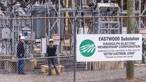 Workers with Randolph Electric Membership Corporation try to repair the Eastwood Substation in West End, North Carolina, on Tuesday.