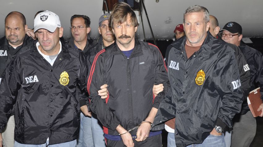 WHITE PLAINS, NY - NOVEMBER 16:  In this photo provided by the U.S. Department of Justice, former Soviet military officer and arms trafficking suspect Viktor Bout (C) deplanes after arriving at Westchester County Airport November 16, 2010 in White Plains, New York. Bout was extradited from Thailand to the U.S. to face terrorism charges after a final effort by Russian diplomats to have him released failed. (Photo by U.S. Department of Justice via Getty Images)