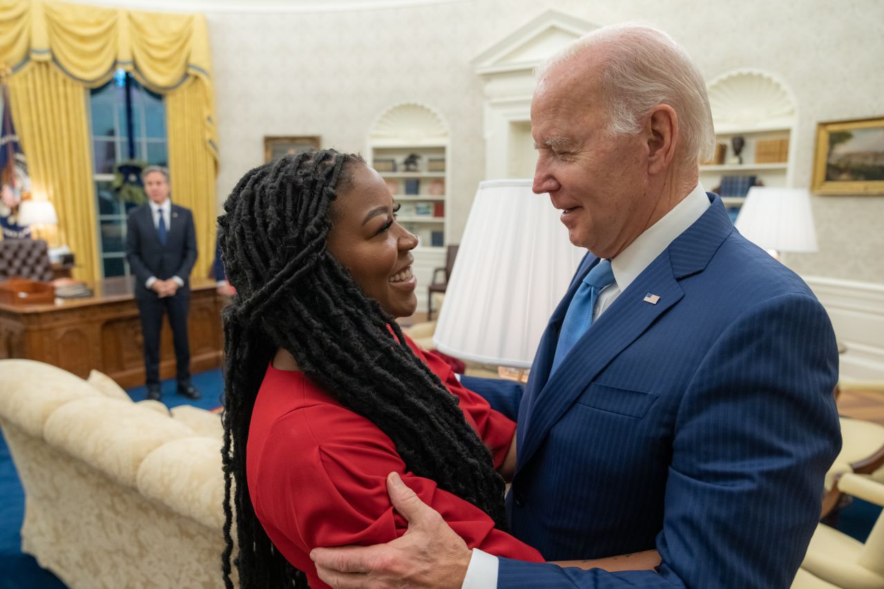 US President Joe Biden hugs Cherelle Griner in the White House Oval Office after the release of her wife, WNBA star Brittney Griner, on Thursday, December 8.