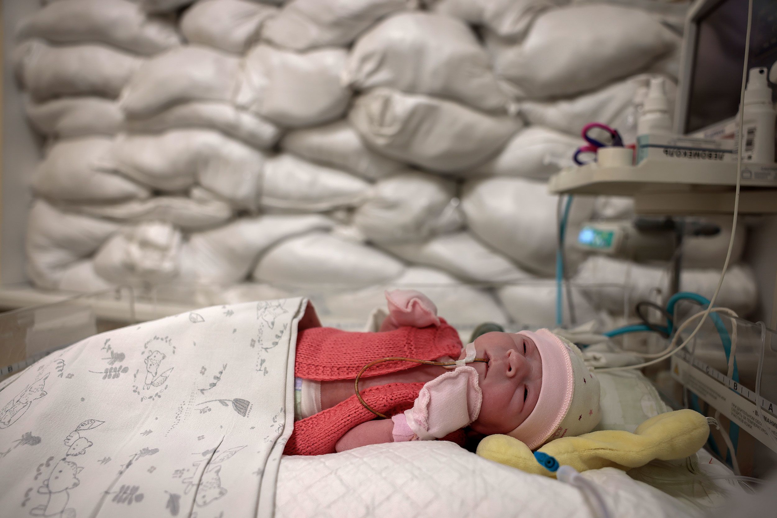 A newborn rests in a hospital's intensive care unit in Kyiv, Ukraine, on Tuesday, December 6.