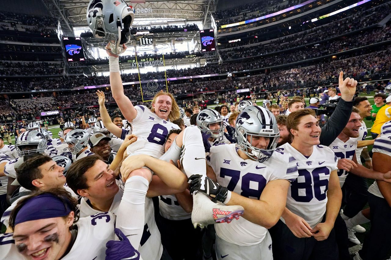 Kansas State kicker Ty Zentner is carried by his teammates after hitting the game-winning field goal in overtime to defeat TCU and win the Big 12 championship on Saturday, December 3.