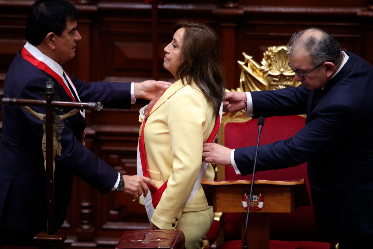 Dina Boluarte receives the presidential sash as she is sworn in as Peru's new president on Wednesday, December 7. Boluarte's predecessor, Pedro Castillo, <a href=