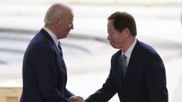 President Joe Biden, left, shakes hands with Taiwan Semiconductor Manufacturing Company Chairman Mark Liu, right, as the two meet on stage after touring the TSMC facility under construction in Phoenix, Tuesday, on Dec. 6, 2022. (AP Photo/Ross D. Franklin)