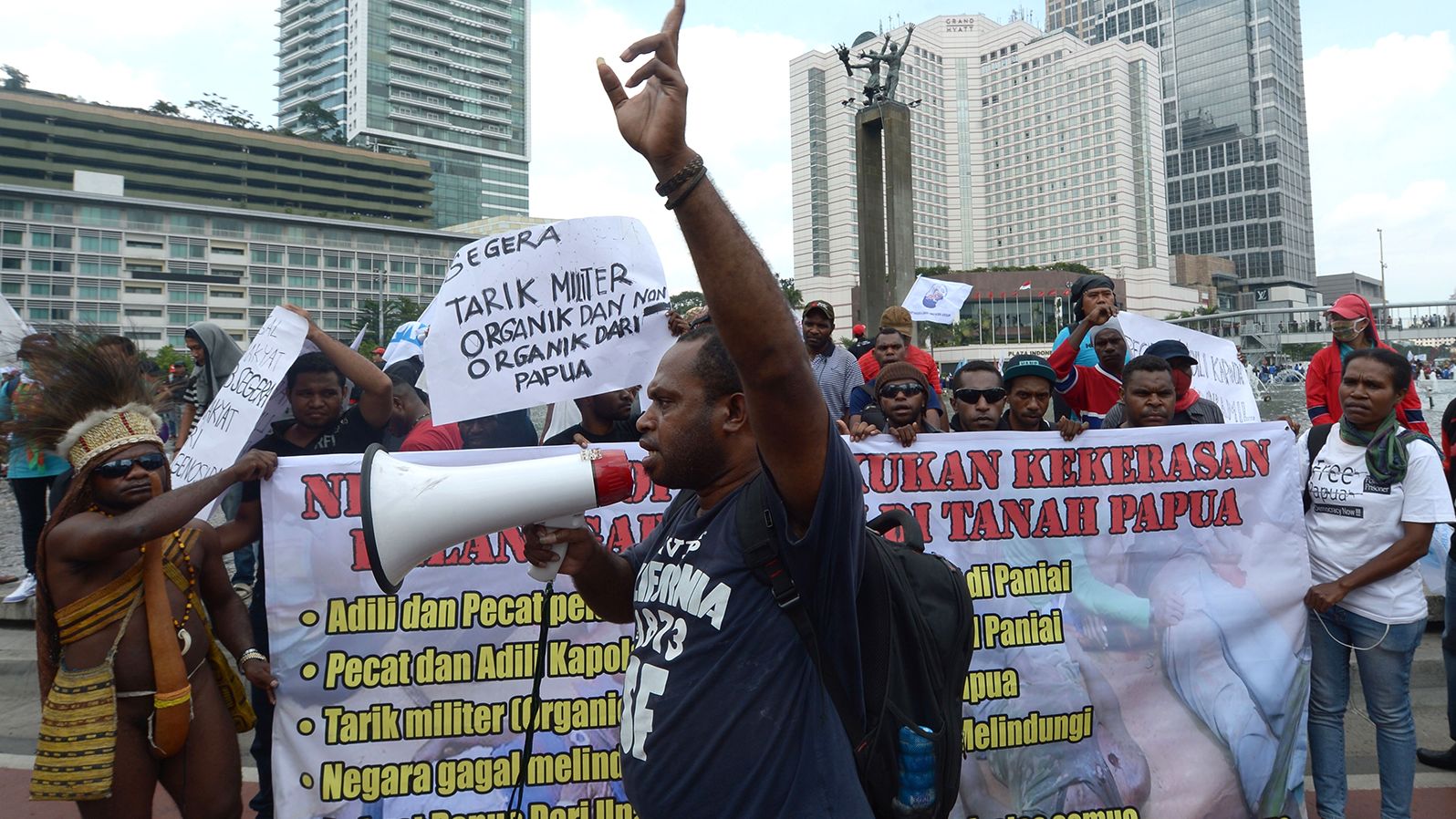 Activists in Jakarta, Indonesia, protest against the shooting of four teenagers in Papua in 2014.