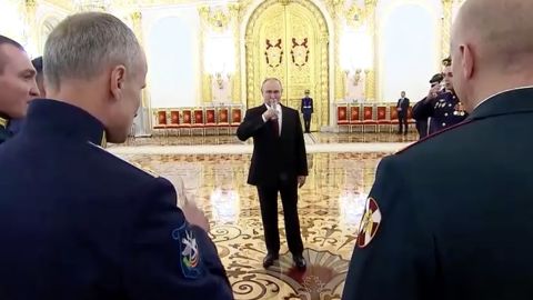 Putin raised a toast before sipping from his champagne glass.