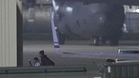 Brittney Griner, right, arrives at Kelly Field in San Antonio, Texas, Friday following her release in a prisoner swap with Russia.