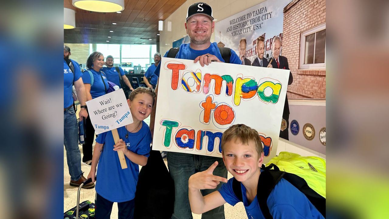 Tampa, Kansas, residents arrive at the airport.