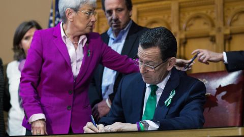 Connecticut Gov. Dannel Malloy (R) signs a gun-control bill on April 4, 2013. 