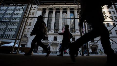 Pedestrians pass in front of the New York Stock Exchange (NYSE) in New York, US, on Wednesday, Nov. 9, 2022. 