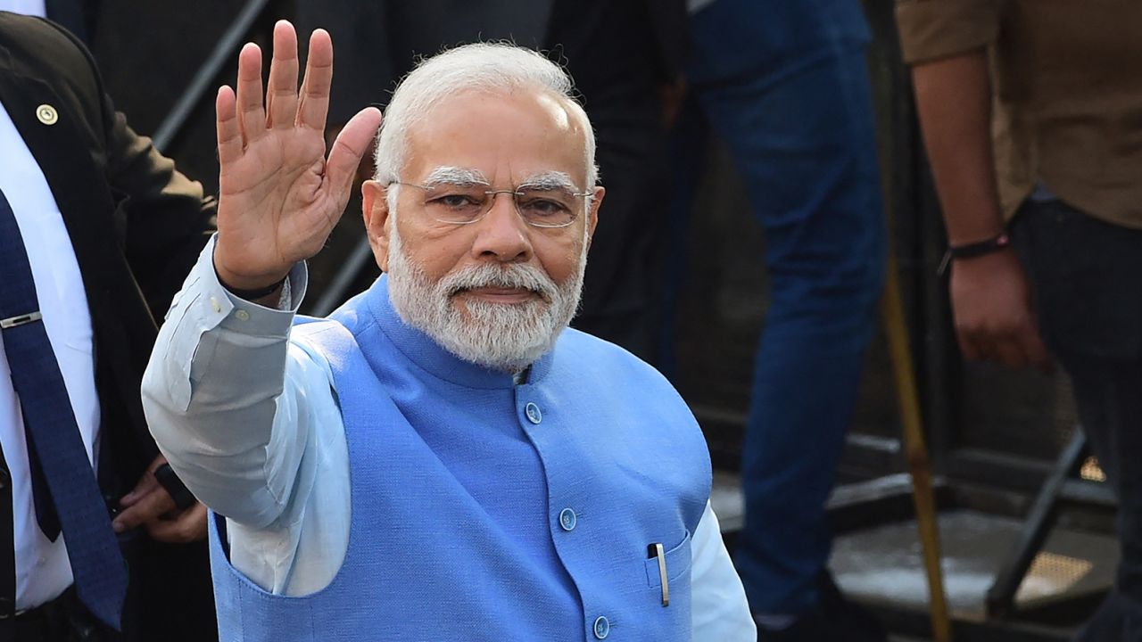Indian Prime Minister Narendra Modi arrives to cast his vote for the second phase of the Gujarat state assembly election in Ahmedabad on December 5, 2022. 