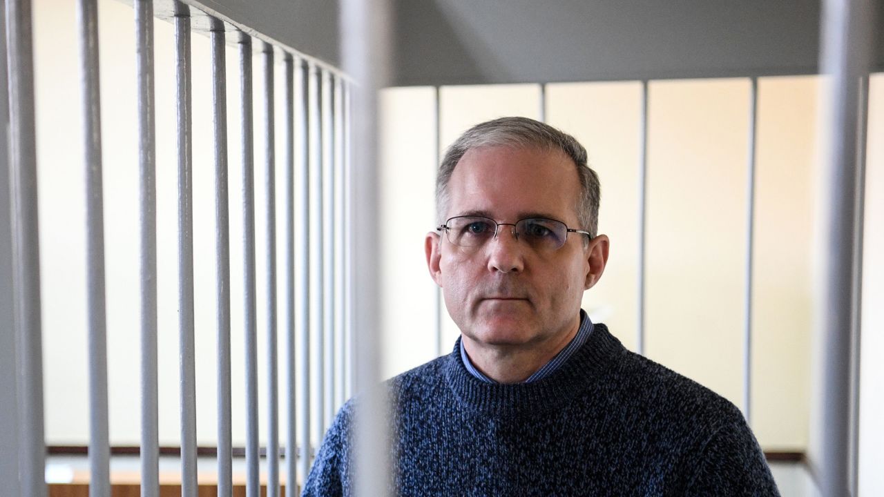 Paul Whelan, a former US Marine accused of spying and arrested in Russia ,stands inside a defendants' cage during a hearing at a court in Moscow on August 23, 2019.