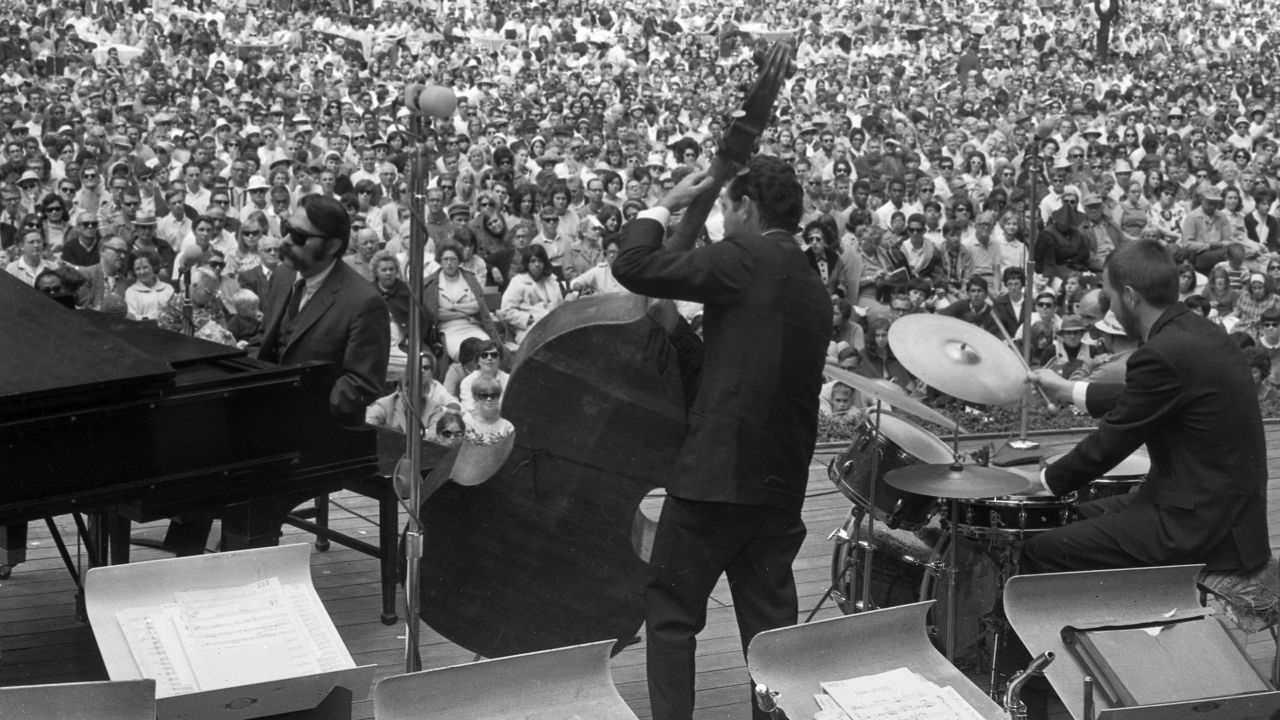 Vince Guaraldi, left, plays piano at a jazz festival in 1966.