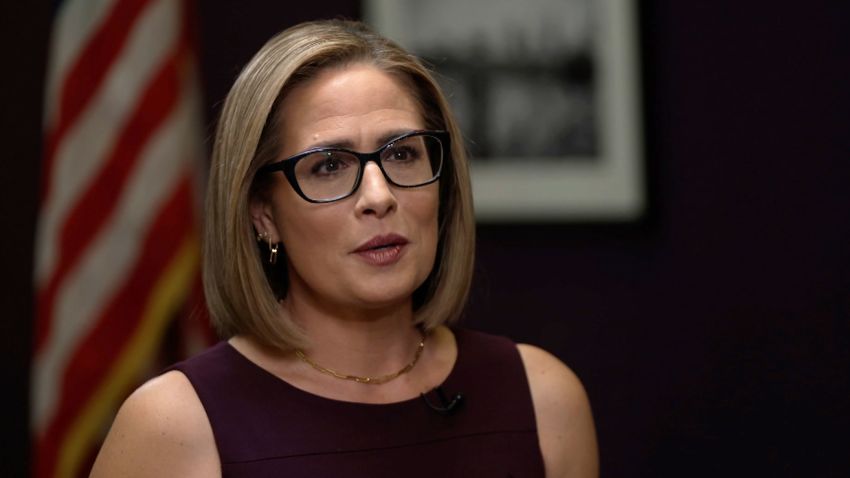 US Sen. Kyrsten Sinema speaks to CNN's Jake Tapper on Thursday, December 8.