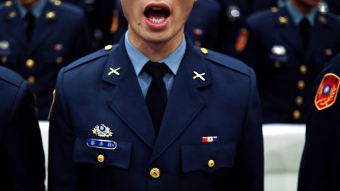 A graduating cadet sings the national anthem during the joint military academies graduation ceremony, in Taipei, Taiwan June 29, 2018.