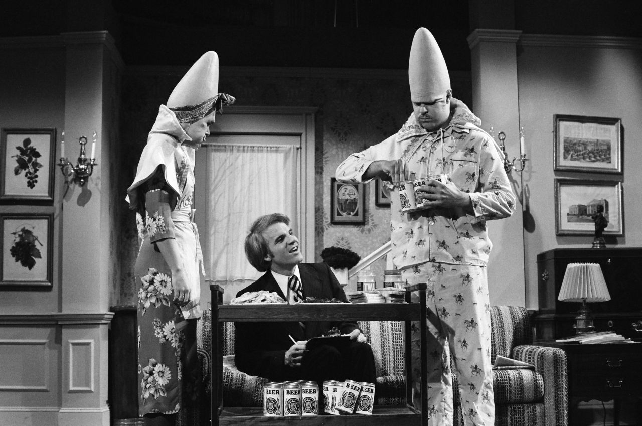 Martin plays an IRS agent in a Coneheads skit in February 1977. The Coneheads were some of the show's most popular characters, and they sparked a spinoff movie in 1993. 