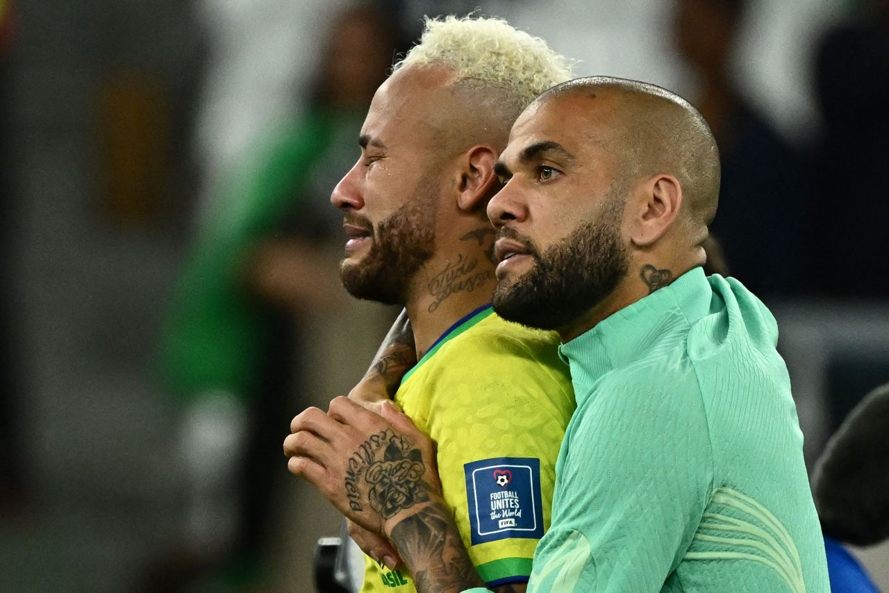 Brazilian star Neymar is comforted by Dani Alves after Brazil were knocked out of the World Cup by Croatia on December 9. Croatia won a penalty shootout after the match ended 1-1.