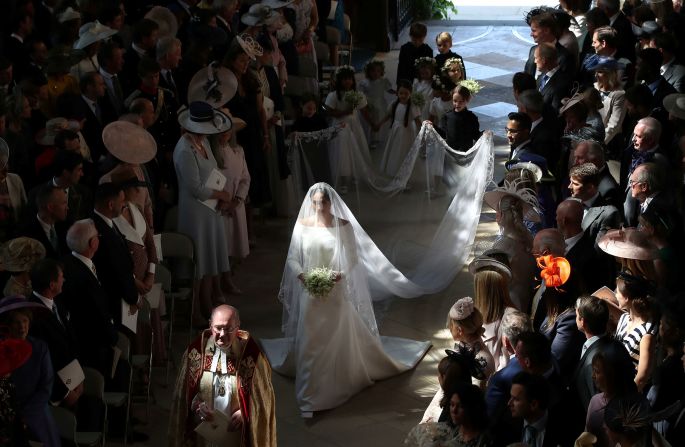 Markle walks down the aisle of St. George's Chapel during <a target="_blank">her wedding to Prince Harry</a> in May 2018. She was unescorted in what was <a target="_blank">an unprecedented step</a> for a royal bride in the United Kingdom. Her father was unable to attend the wedding <a target="_blank">because of health concerns</a>.