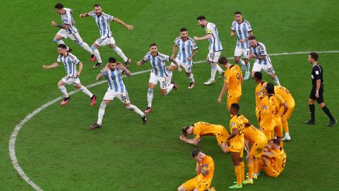 Argentinian players celebrate with Dutch faces after penalty shootout.