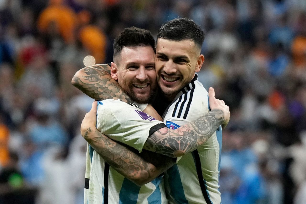 Argentina's Lionel Messi, left, and Leandro Paredes celebrate their berth in the semifinals.