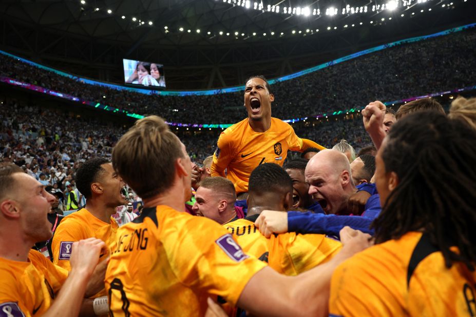 Dutch players celebrate after Wout Weghorst scored late into second-half stoppage time to extend the match.