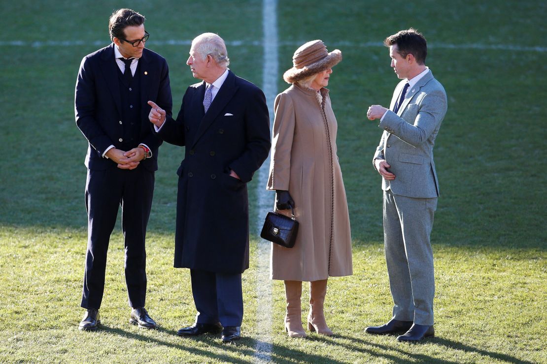 Wrexham Football Club co-owners Ryan Reynolds and Rob McElhenney speak with Britain's King Charles and Queen Camilla, as they visit Wrexham Football Club.