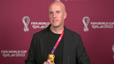 Val poses for a photo at the awards ceremony in Doha during the World Cup. 