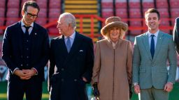 WREXHAM, UNITED KINGDOM - DECEMBER 9: King Charles III and Camilla, Queen Consort meet with Co-Owners of Wrexham AFC, Ryan Reynolds and Rob McElhenney during their visit to Wrexham Association Football Club (AFC) on December 9, 2022 in Wrexham, Wales.  Hollywood actors, Ryan Reynolds and Rob McElhenney bought Wrexham AFC, Wales' oldest football club and the third oldest professional club in the world, in 2020. During the visit, Their Majesties met the owners, players and learnt about the redevelopment of the club.  (Photo by Arthur Edwards-WPA Pool/Getty Images)