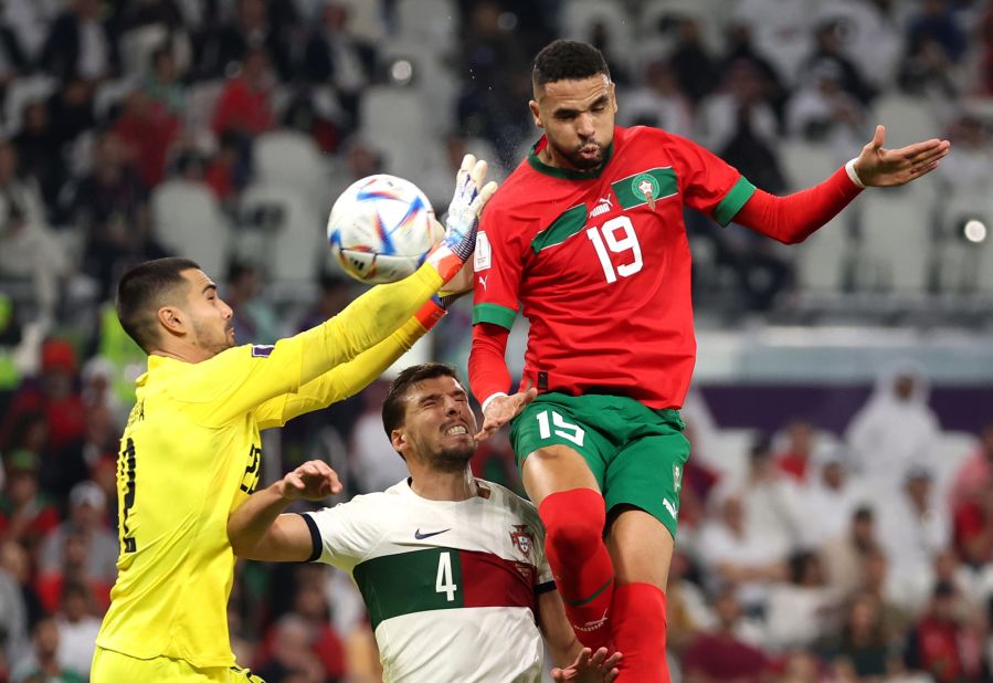 Youssef En-Nesyri heads the ball to score Morocco's goal against Portugal.